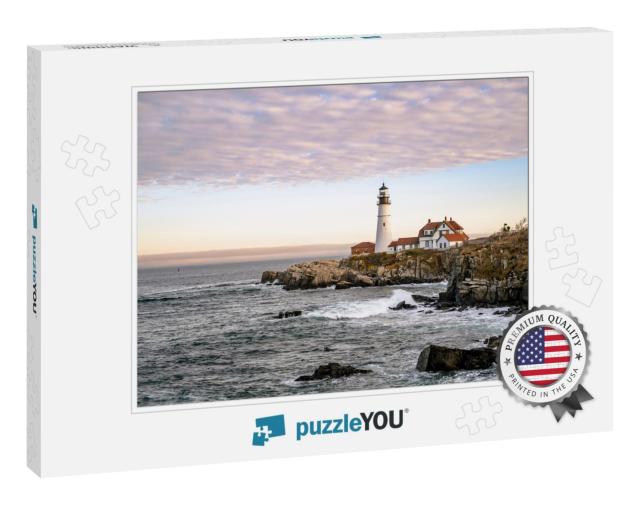 Lighthouse Illuminated by the Setting Sun on a Rocky Prom... Jigsaw Puzzle