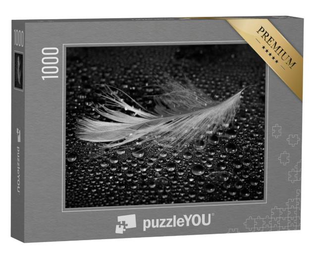 Puzzel 1000 stukjes „Licht veertje te midden van waterdruppels“