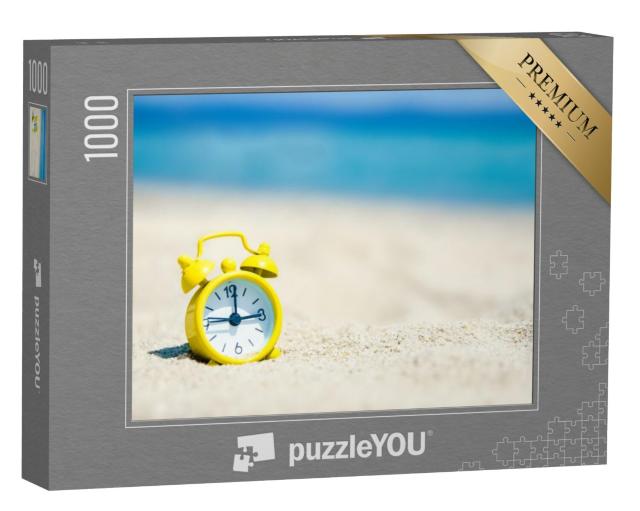 Puzzel 1000 stukjes „Gele wekker in het zand aan zee“