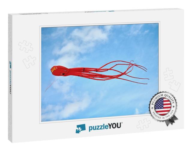 Bright Red Pink Octopus Kite Flying Against Background of... Jigsaw Puzzle