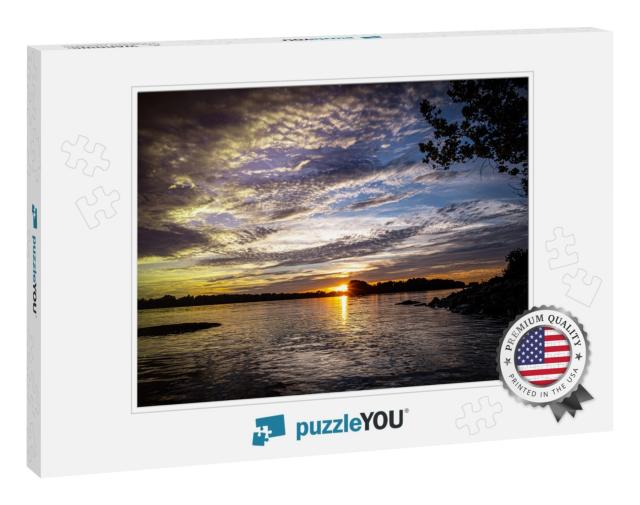 A Beautiful View of the Sun on the Horizon Next to the Mi... Jigsaw Puzzle