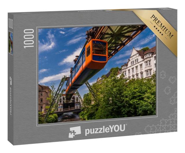 Puzzle 100 Teile „Die Schwebende Straßenbahn in Wuppertal“