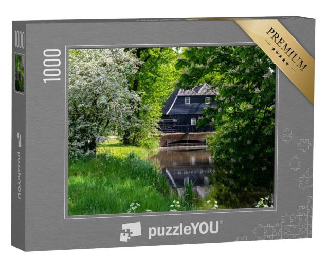 Puzzel 1000 stukjes „Voorjaarsbloesem in een groen park met een oude watermolen in het centrum van Eindhoven, Noord-Brabant“