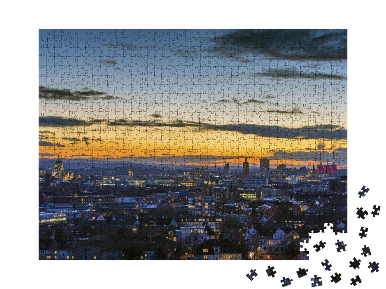 Puzzle 1000 Teile „Luftbildaufnahme von Hannover am Abend“