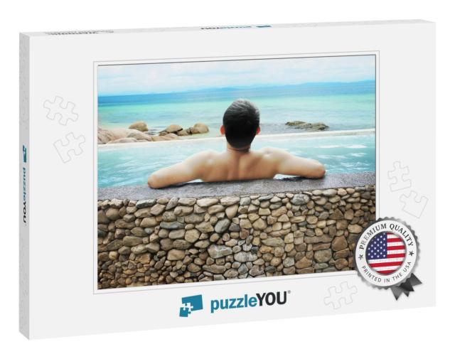 Asian Man Soaking in Outdoor Pool with Sky... Jigsaw Puzzle