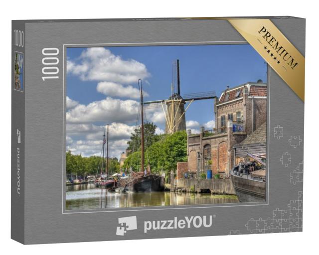 Puzzel 1000 stukjes „Windmolen en historische boten in een gracht in Gouda“