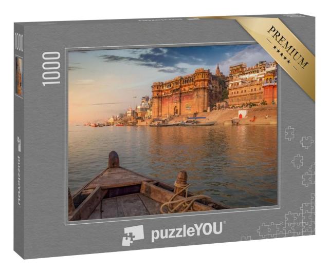Puzzle 1000 Teile „Tempel und Gebäude am Fluss Ganges bei Sonnenuntergang“