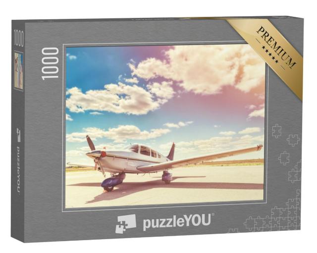 Puzzel 1000 stukjes „Geparkeerd propellervliegtuig“