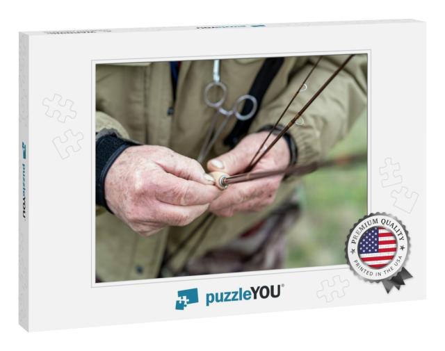 Close-Up of a Fisherman's Hand Adjusting Fly Fishing Rods... Jigsaw Puzzle