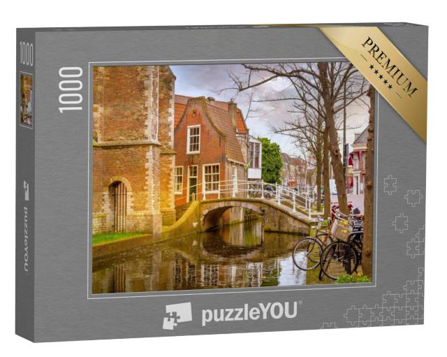 Puzzel 1000 stukjes „Delft met traditionele Nederlandse huizen, brug en gracht in het stadscentrum“