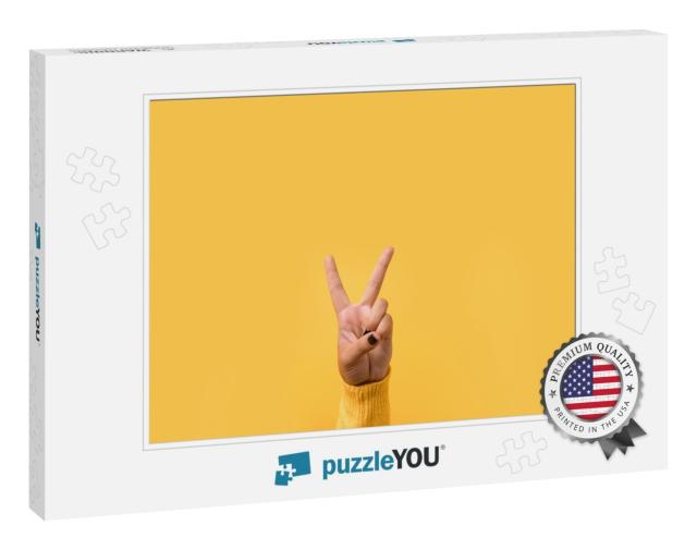 Hand Gesture V Sign for Victory or Peace Sign Over Yellow... Jigsaw Puzzle
