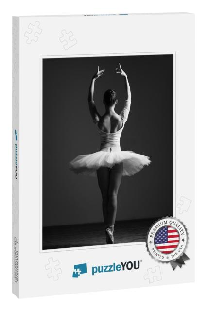 Young Beautiful Ballet Dancer is Posing in Studio... Jigsaw Puzzle