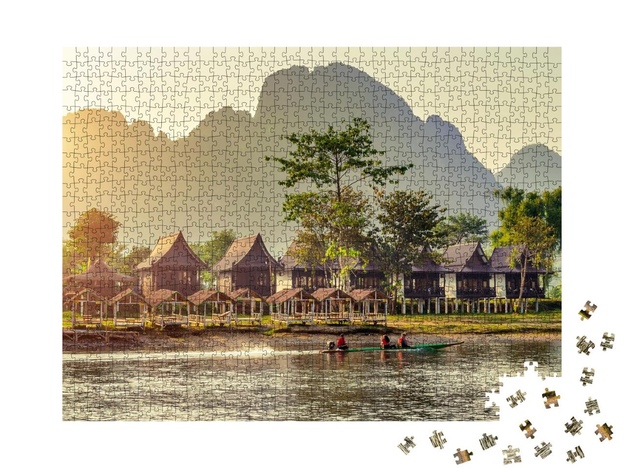 Puzzle 1000 Teile „Malerische Dorfbungalows entlang des Nam Song Flusses in Vang Vieng, Laos“