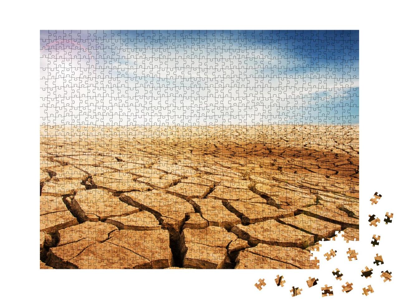Puzzle 1000 Teile „Trockener und rissiger Wüstenboden, blauer Himmel mit Wolken“