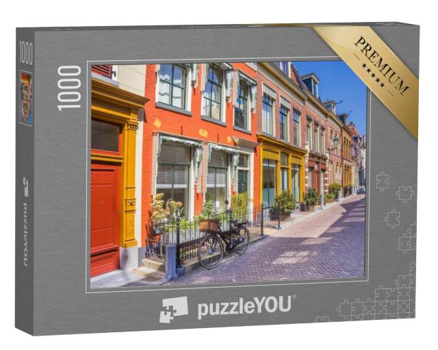 Puzzel 1000 stukjes „Fiets voor de kleurrijke huizen van de historische stad Leeuwarden, Nederland“