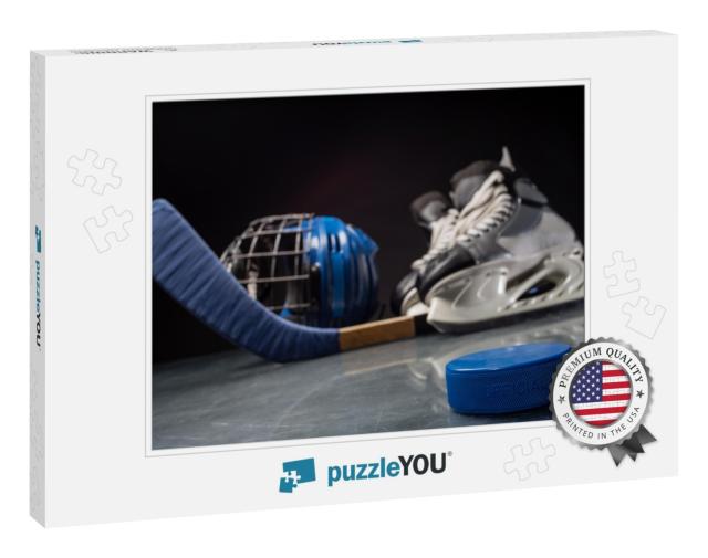 Close-Up on Hockey Puck & Hockey Equipment in Background... Jigsaw Puzzle