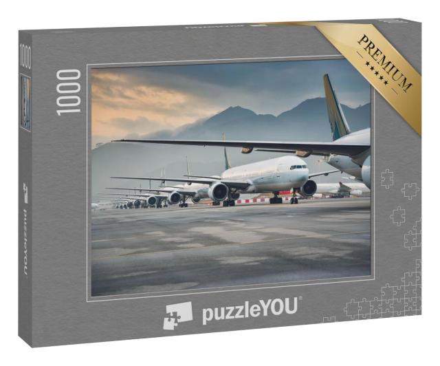 Puzzle 1000 Teile „Geparkte Flugzeugflotte“