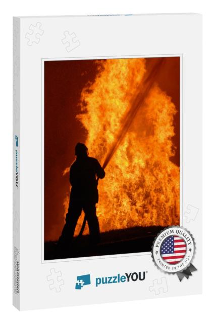 Lone Fireman Battling Against Raging Fire, Note Shallow F... Jigsaw Puzzle