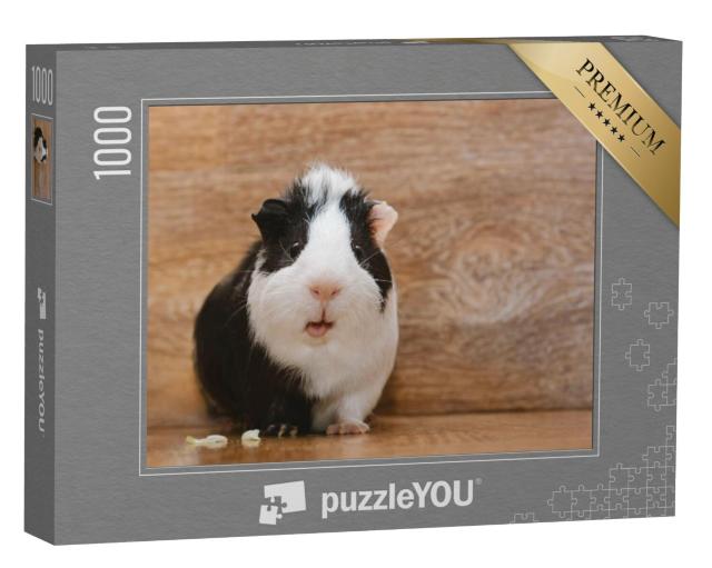 Puzzel 1000 stukjes „Schattige zwart-witte cavia die koolbladeren eet“