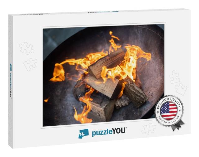 Outdoor Log Burning Fire in Black Metal Fire Pit. Chopped... Jigsaw Puzzle