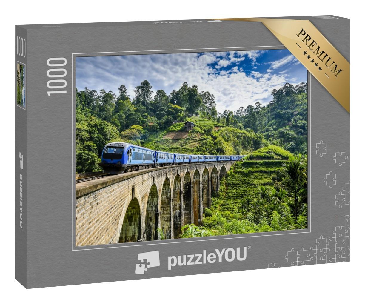 Puzzle 1000 Teile „Eisenbahnbrücke auf grüner Berglandschaft“