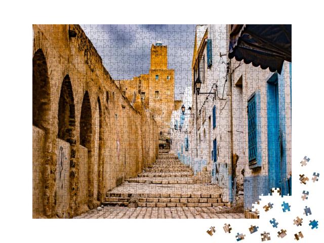 Puzzle 1000 Teile „Straße durch Medina, Tunesien“