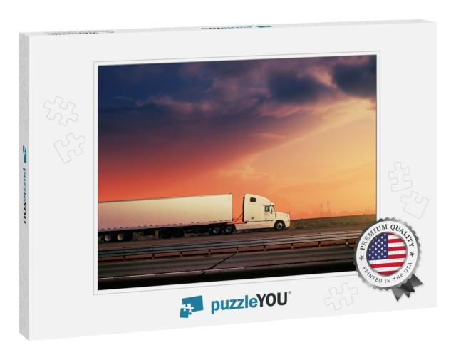 White Freight Truck Driving on Freeway Road Under Red Sun... Jigsaw Puzzle