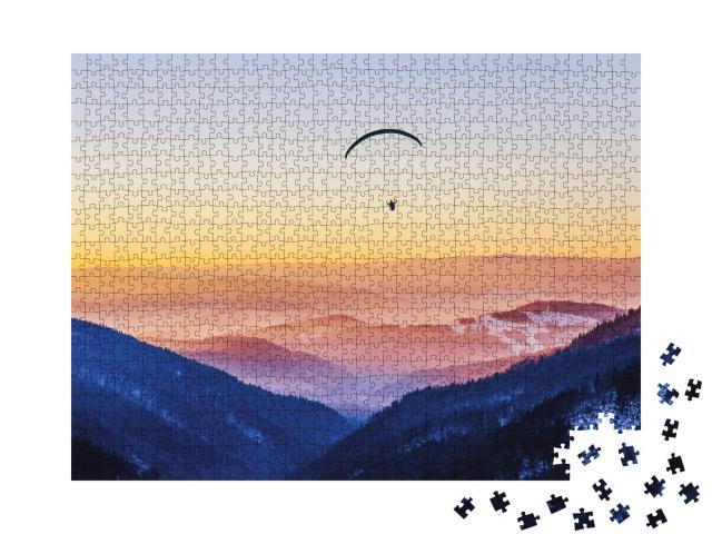 Puzzle 1000 Teile „Mit dem Gleitschirm in den Sonnuntergang “