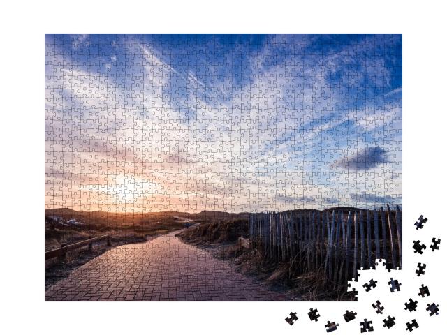 Puzzle 1000 Teile „Wolken über dem Radweg auf Norderney“