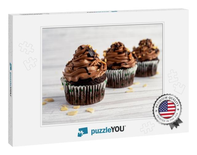 Delicious Chocolate Cupcake on White Wooden Table... Jigsaw Puzzle
