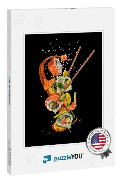 Flying Sushi Pieces Isolated on Black Background. Concept... Jigsaw Puzzle