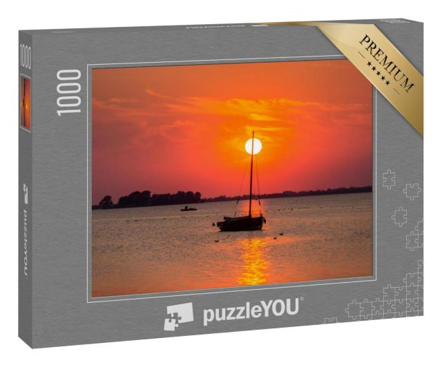 Puzzle 1000 Teile „Sonnenuntergang am Steinhuder Meer: Boot im roten Licht, Niedersachsen“