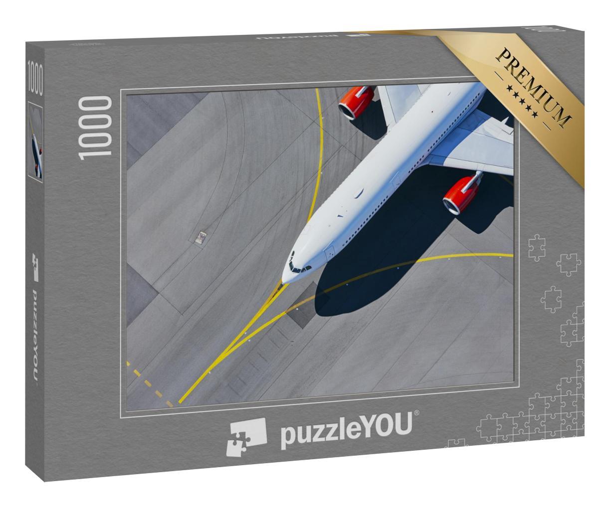 Puzzle 1000 Teile „Blick aus der Vogelperspektie: Flugzeug auf dem Weg zur Startbahn“