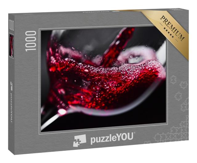 Puzzle 1000 Teile „Rotwein im Weinglas vor schwarzem Hintergrund“